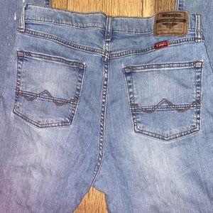 Wrangler work jeans used to work in , no rips i know of but a few spots as shown